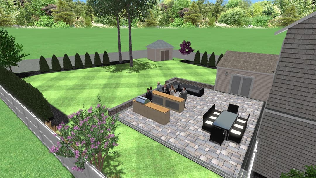 Aerial view of a landscaped backyard with a patio, furniture, and trees in a residential setting.