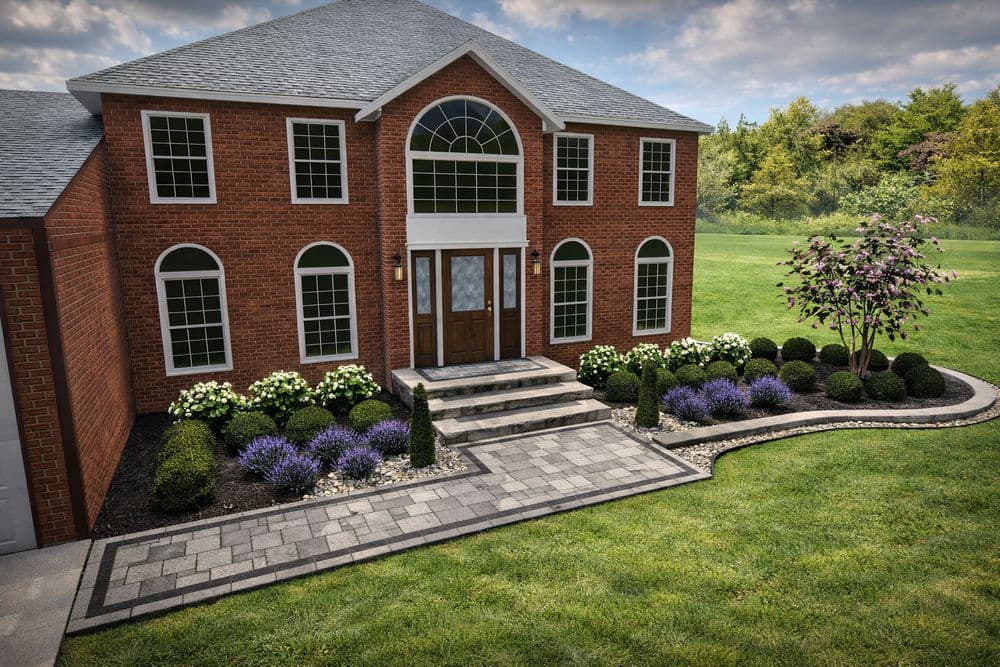 Elegant brick house with landscaped garden, complete with shrubs and blooming flowers.