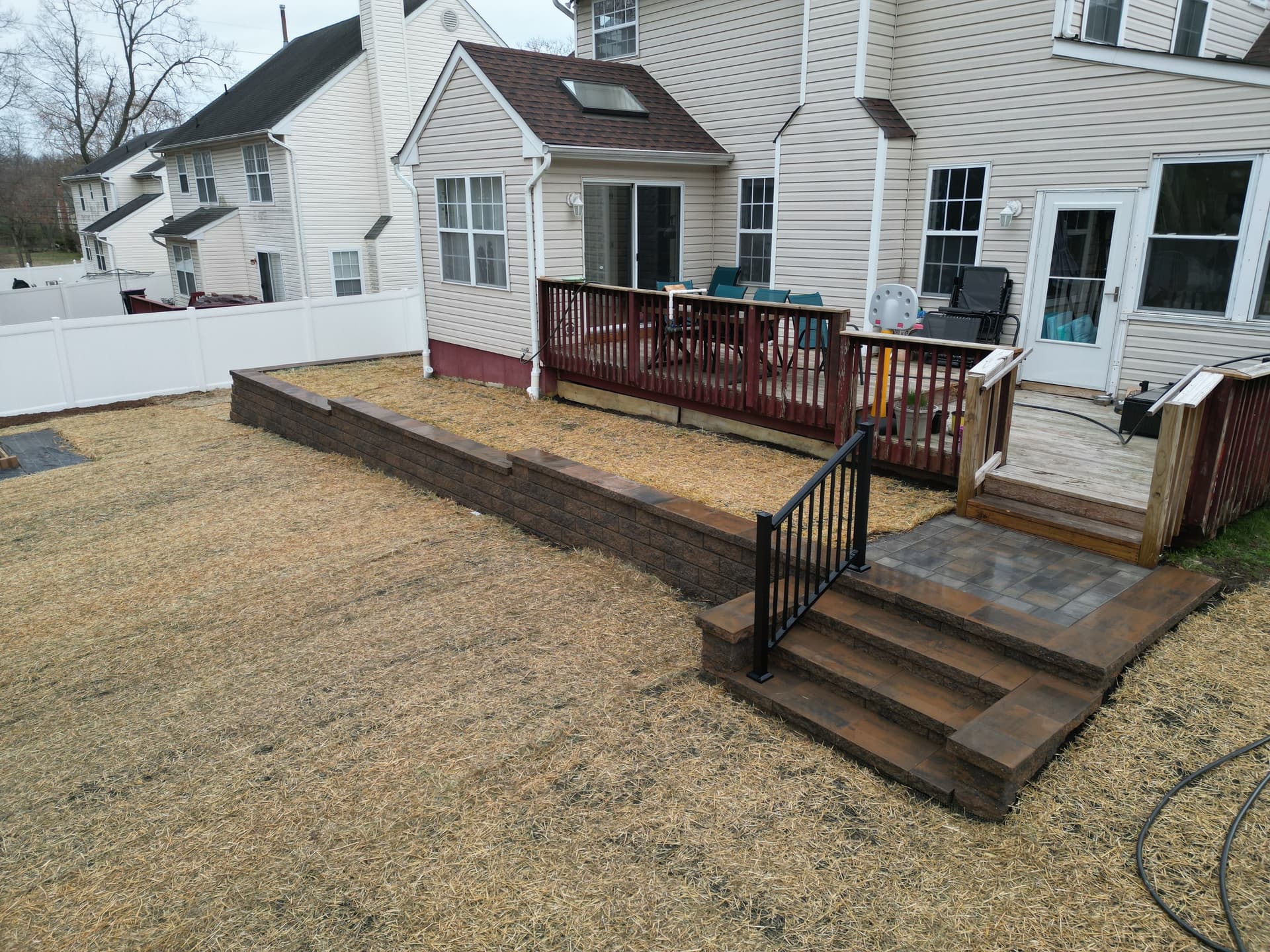 Backyard Upgrade with Retaining Wall and Steps image
